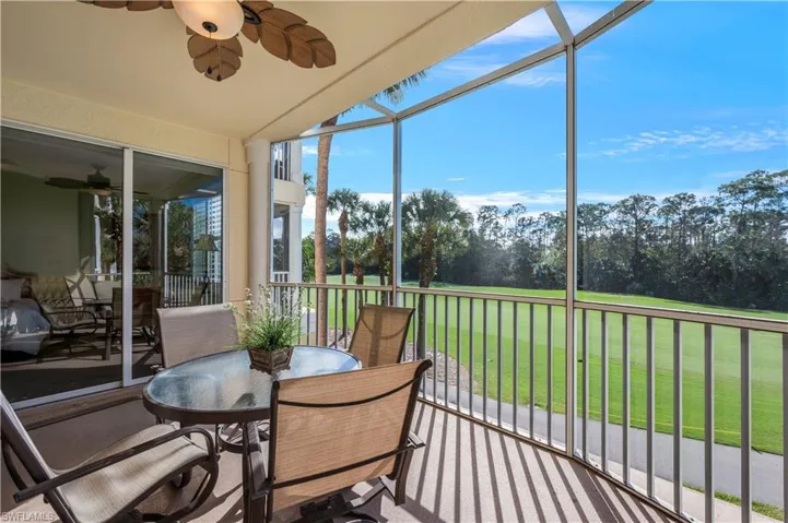 Sunroom / solarium featuring ceiling fan