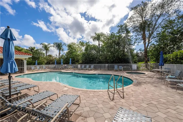 Pool featuring fence and a patio