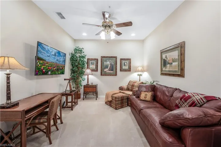 Living area with baseboards, visible vents, a ceiling fan, light colored carpet, and recessed lighting