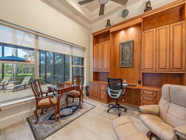 Den/office with views of lanai, golf course and lake