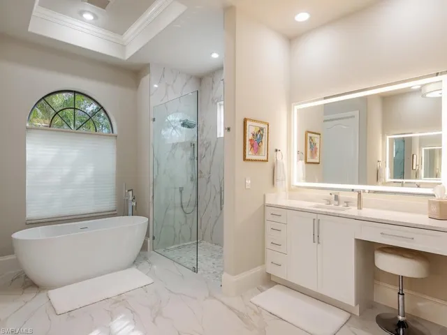 Primary bedroom en-suite with free standing tub and large walk-in shower