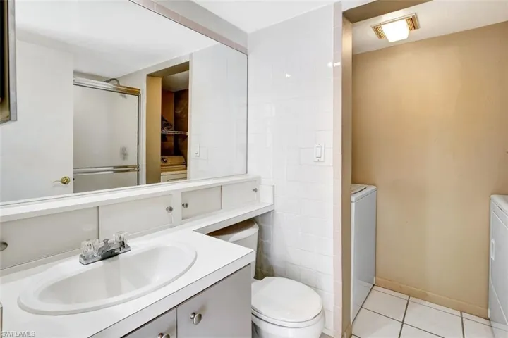 Guest bathroom with shower and laundry