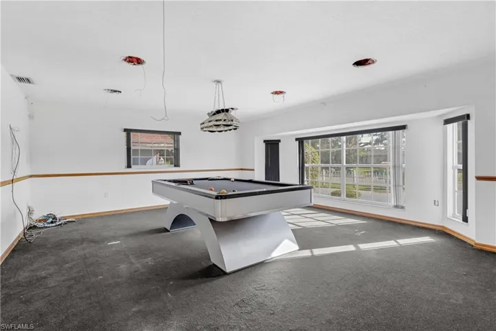 Playroom featuring pool table and light colored carpet