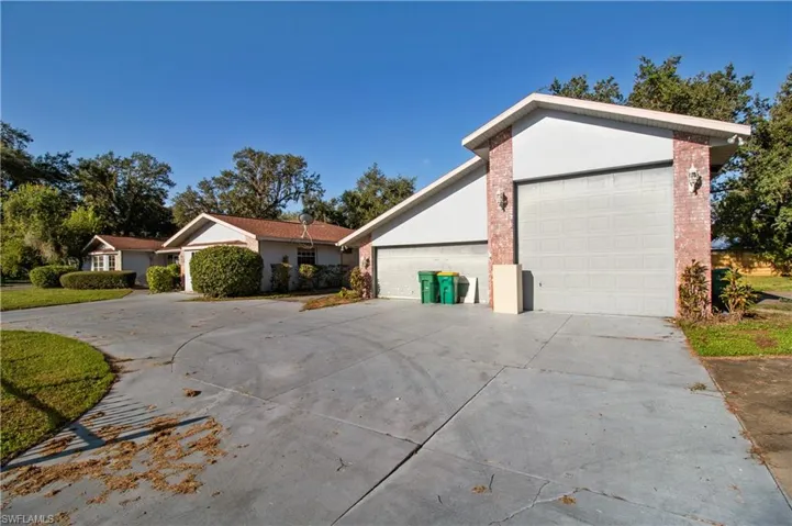 View of side of home featuring a garage