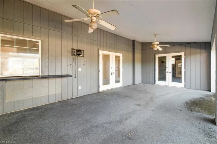View of patio / terrace with french doors and ceiling fan