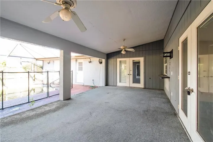 View of patio featuring french doors and ceiling fan
