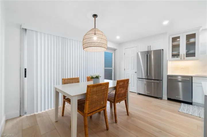 Dining room featuring recessed lighting and light wood finished floors