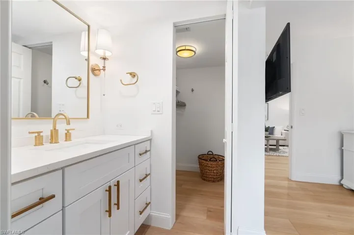 Bathroom featuring vanity and light wood-style flooring