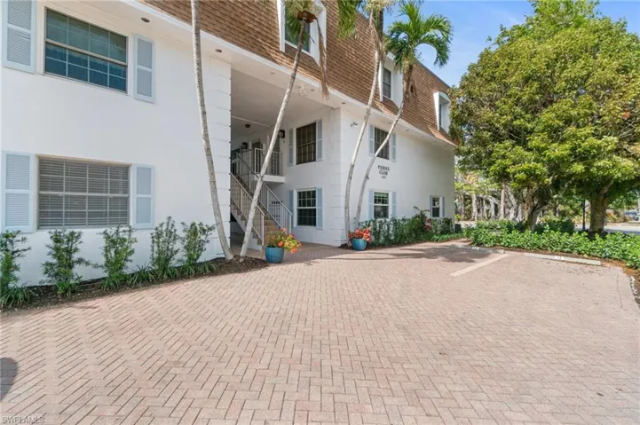 View of property featuring stairway