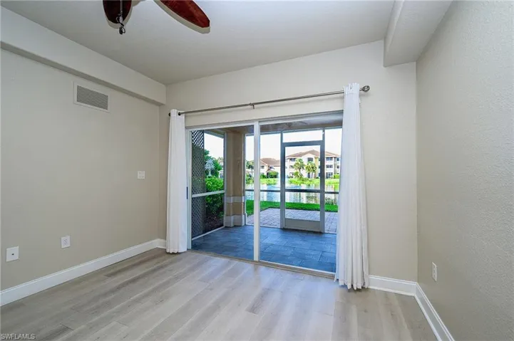Living room - check out that gorgeous lake view and paver patio!