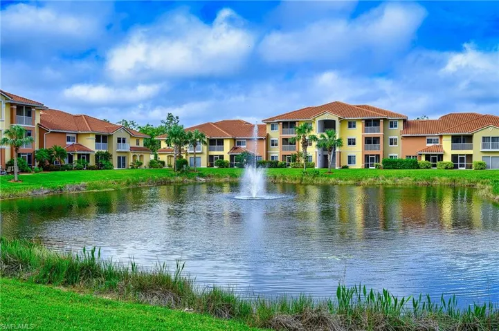 View from the living r room looking out at the Community Lake with water feature