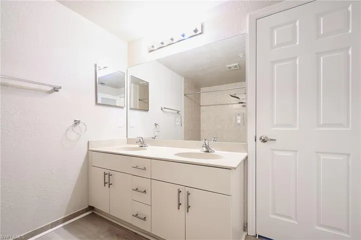 Primary Bedroom  featuring double sink vanity