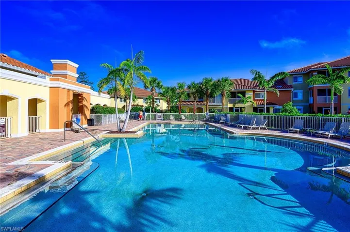 View of pool - hot tub adjacent as well as community fireplace