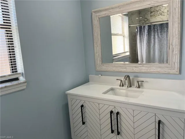 Bathroom with vanity and walk in shower