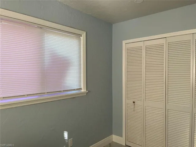Unfurnished bedroom featuring a closet