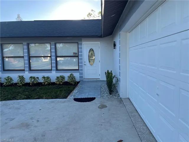 Entrance to property with a garage