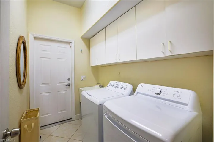 Garage featuring electric water heater