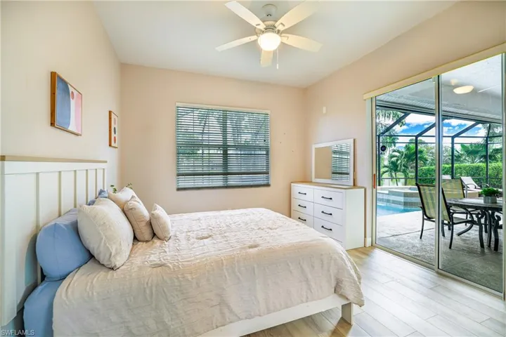 Laundry room featuring washer and clothes dryer, light tile patterned floors, and cabinet space