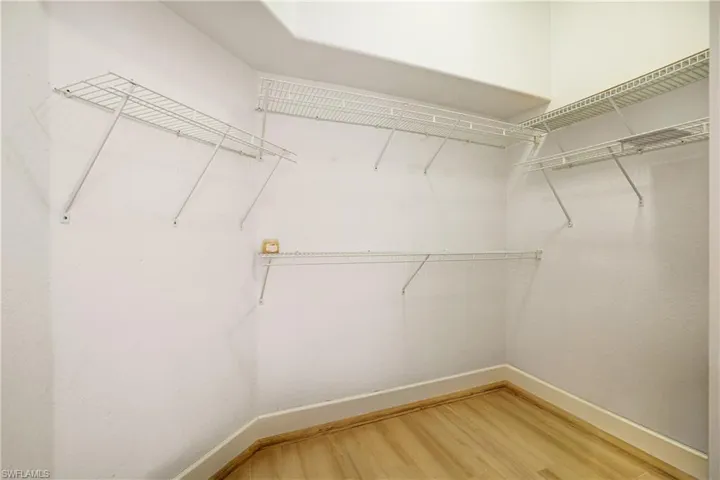 Bedroom featuring ceiling fan and wood finished floors