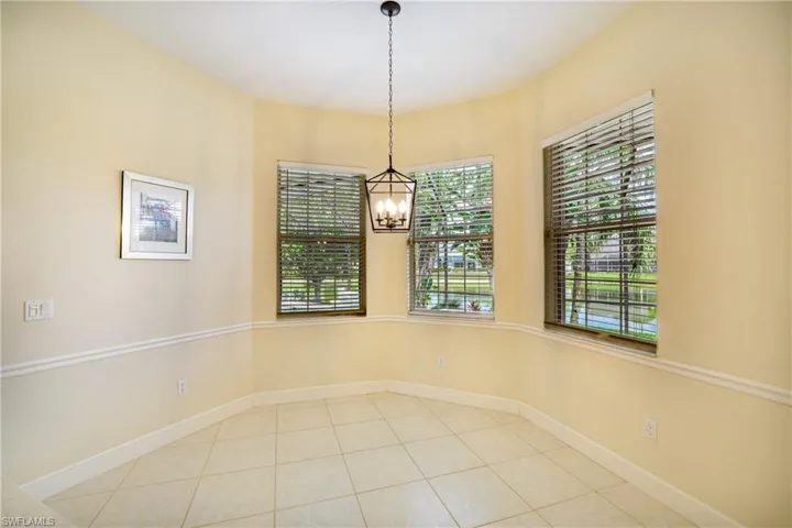 Bedroom with access to exterior, light wood-type flooring, and ceiling fan