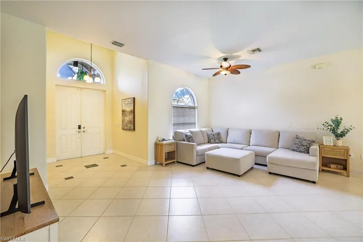 Dining room featuring a chandelier and light tile patterned floors