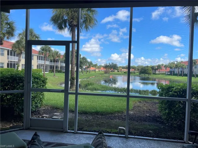 Unfurnished sunroom featuring a water view