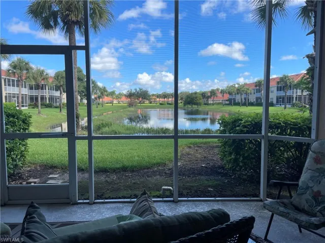 Unfurnished sunroom featuring a healthy amount of sunlight and a water view