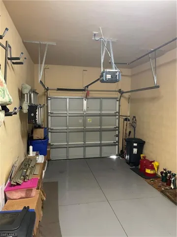 Garage featuring a garage door opener