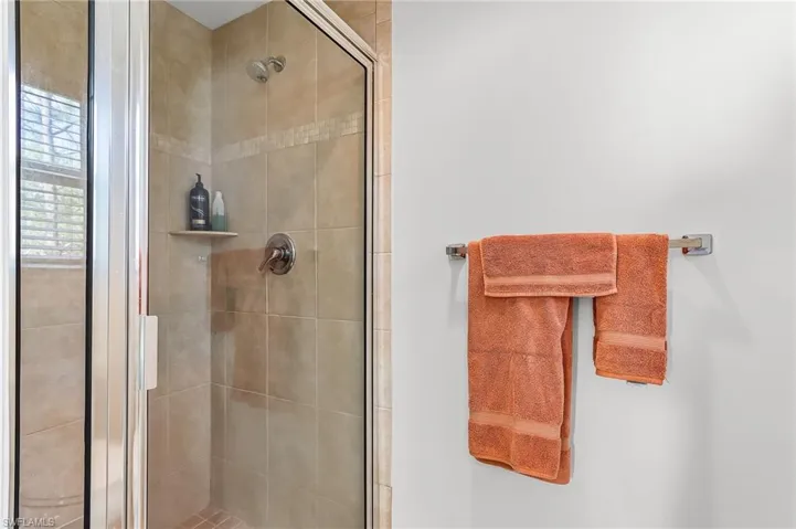 Full bathroom featuring a stall shower