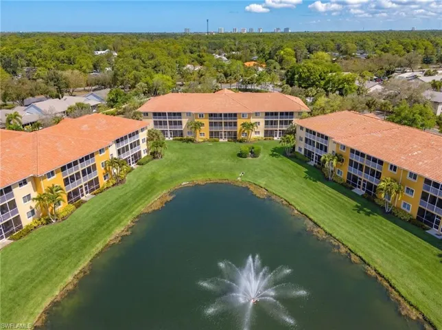 Aerial view of apartment complex and a nearby body of water