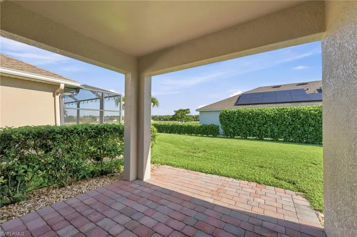 Covered lanai, large backyard with privacy and room for a pool.