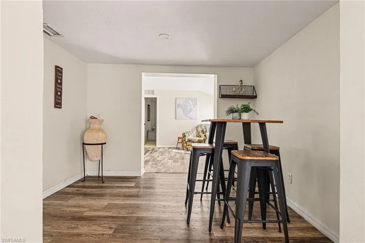 Dining room with wood finished floors and baseboards