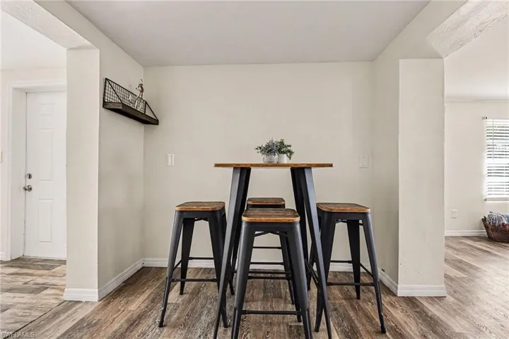 Dining area with wood finished floors and baseboards