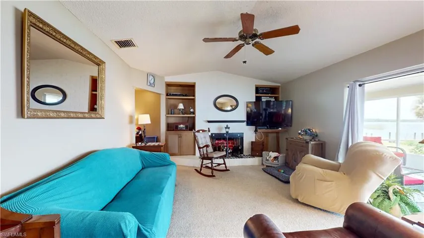 Living room with wood buring fire place