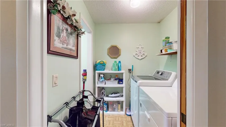 Laundry room with walk-in closet