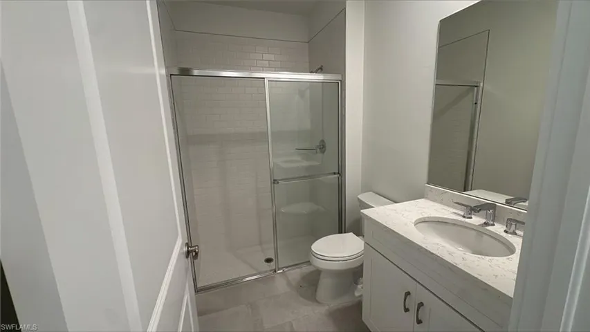 Guest bathroom with walk-in shower and vanity