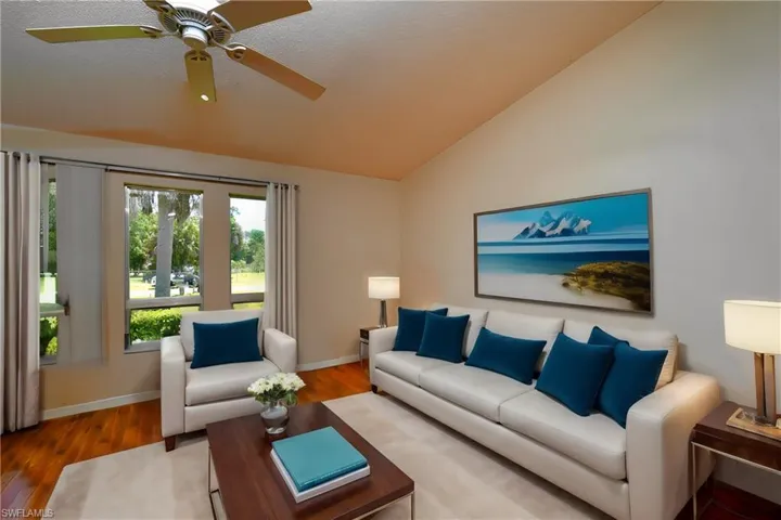 Wood look tile flooring and cathedral ceilings.