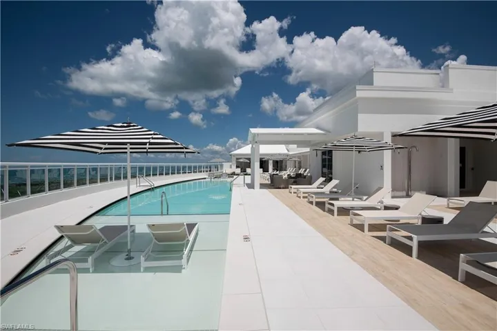 Community pool featuring a patio area