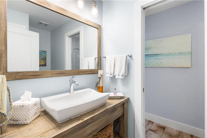3rd ensuite bath has walk in shower, floor to ceiling tile. Fabulous vanity!