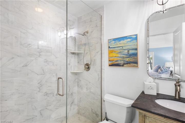 2nd ensuite bath offers a walk in shower with floor to ceiling tile.