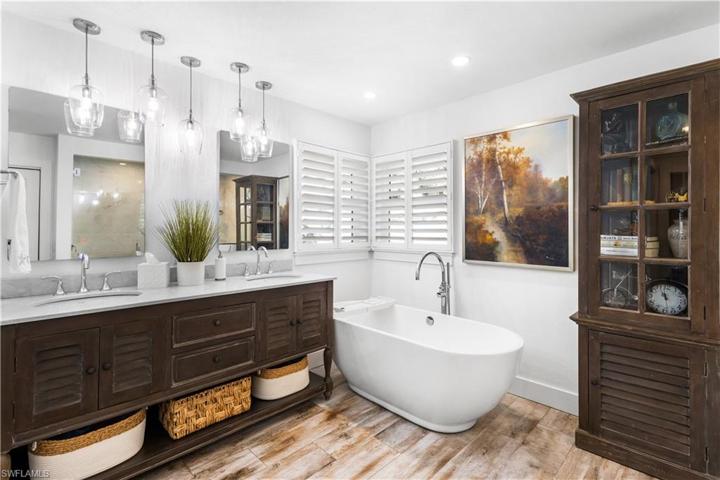 What an amazing primary ensuite bath with a comfort height dual vanity, back lit mirrors. Natural light pours into this bathroom!