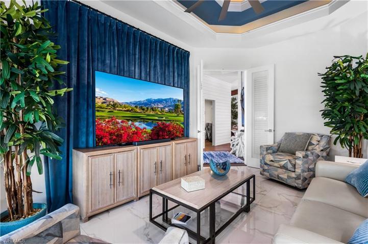 Another view of your T.V. media room! Double uplit tray ceiling in this space.