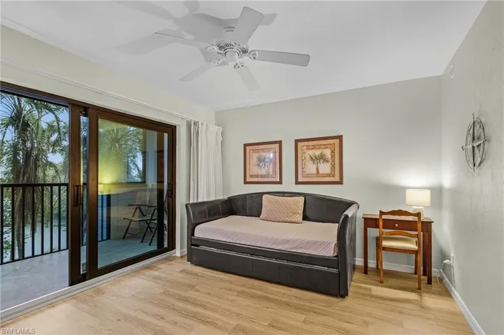 Living area featuring ceiling fan and light hardwood / wood-style floors
