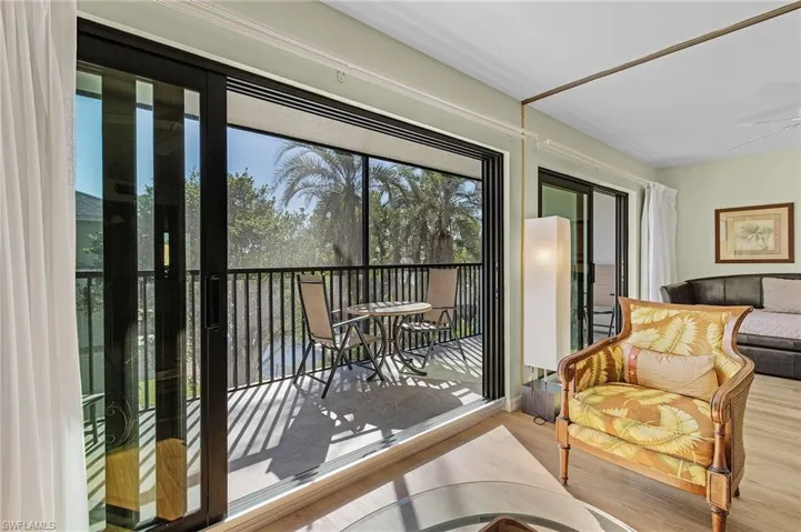 Sunroom featuring ceiling fan