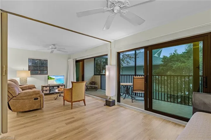 Sunroom / solarium featuring ceiling fan
