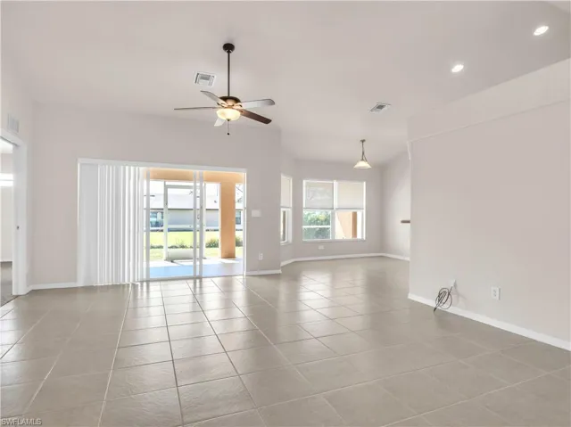 Unfurnished Entrance and Living Room w Breakfast Nook in back right