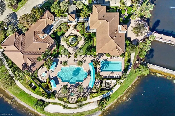 Main club with 2 resort pools and more amenities over the bridge