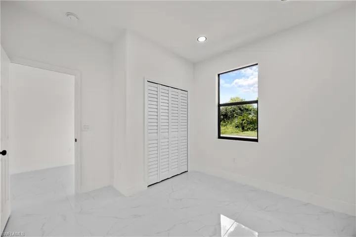 Unfurnished bedroom with a closet