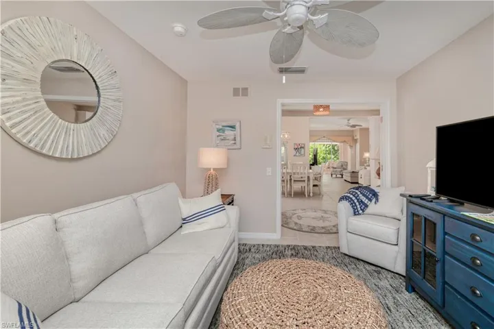 Tiled living room with ceiling fan