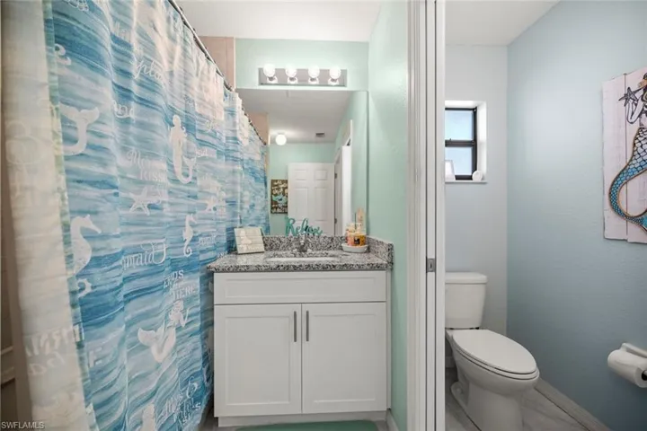 Full bathroom pool bath featuring vanity, and baseboards
